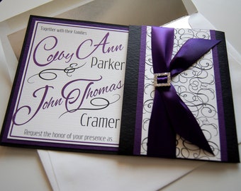 May include: A wedding invitation with a purple ribbon and a black and white background. The invitation reads "Together with their families Colby Ann & Parker John Thomas Cramer Request the honor of your presence as..."