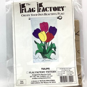 May include: A Flag Factory pattern for a tulip-themed flag. The pattern includes instructions for a 28" x 49" flag and lists the fabric needed in yards: white, dark purple, hot pink, Irish green, mint green, red, and yellow.