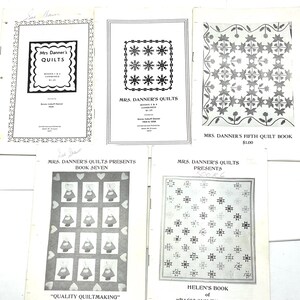 May include: A collection of vintage quilt books, featuring titles like "Mrs. Danner's Quilts" and "Mrs. Danner's Fifth Quilt Book." The covers display intricate quilt patterns and text, with prices listed. The books are in black and white.