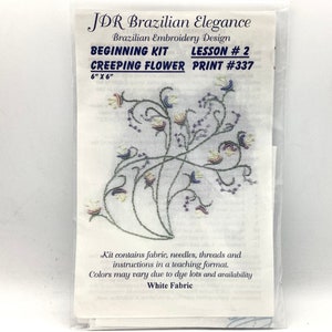 May include: A white fabric embroidery kit with a floral design. The kit includes fabric, needles, threads, and instructions. The kit is for a beginner level embroidery project and is titled "JDR Brazilian Elegance Beginning Kit Lesson #2 Creeping Flower Print #337 6" x 6" White Fabric".