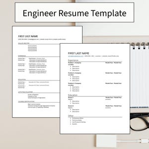 May include: Two white resume templates with the text "Engineer Resume Template" at the top. The resumes include sections for skills, experience, education, and activities. A notepad, glasses, and a white USB cable are visible.