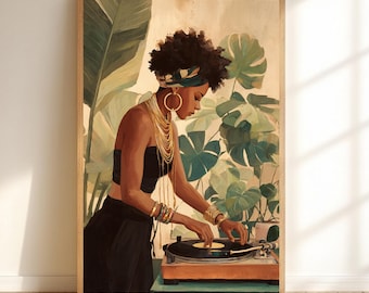 May include: A framed art print depicts a woman in a black outfit, adorned with gold jewelry, operating a record player. The background features lush green plants. The artwork is in a wooden frame, creating a warm, inviting aesthetic.