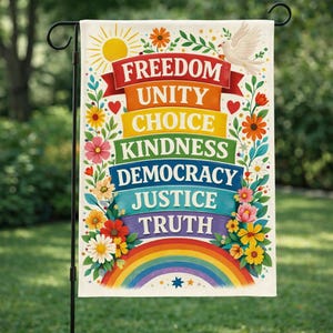 May include: A garden flag with a colourful design. The flag features the words "Freedom, Unity, Choice, Kindness, Democracy, Justice, Truth" in colourful banners. A rainbow, flowers, a dove, and a sun complete the design.