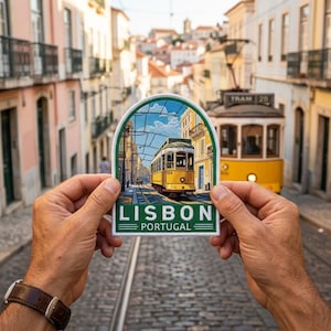 May include: A patch featuring a yellow tram on tracks in Lisbon, Portugal, held in front of a similar tram on a cobblestone street. The patch has a green border and the words "LISBON PORTUGAL".