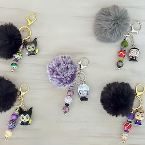 Sleutelhanger schurkenkralen: Maleficent, Ursula, Queen, sleutelhanger pompon