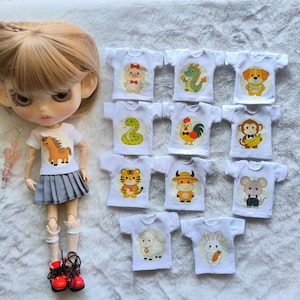 May include: A set of three ceramic mugs with a speckled, matte finish. Each mug features a different color: light blue, cream, and gray. The mugs have a simple, modern design and a comfortable handle.