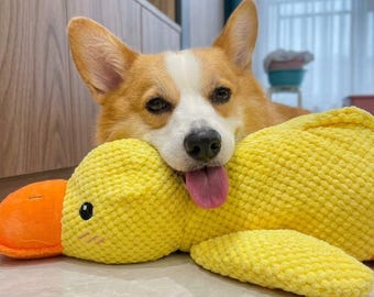 Juguete de peluche calmante de pato para perros, suave y chirriante, alivia la ansiedad de los cachorros.