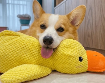 Juguete de peluche calmante de pato para perros, suave y chirriante, alivia la ansiedad de los cachorros.