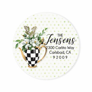 May include: A round return address label with a white background and green polka dots. A black and white checkered teapot with a gold spout and handle is filled with white magnolia flowers and green leaves. The text "THE Jensens 2300 Carlito Way Carlsbad, CA 92009" is printed in black.