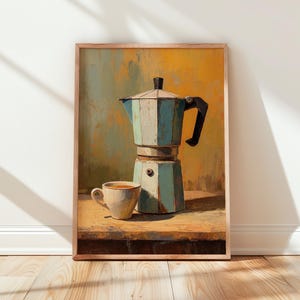 Könnte beinhalten: Ein gerahmter Kunstdruck mit einer Kaffeemaschine und einer Tasse. Die Kaffeemaschine ist hellblau und die Tasse ist weiß. Der Hintergrund ist eine Mischung aus Gelb, Orange und Braun.