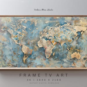 May include: A framed world map art print with a distressed, textured appearance. The artwork features a blue and beige color palette, with landmasses in beige and oceans in blue. The frame is made of light-colored wood. Text at the bottom reads "FRAME TV ART".