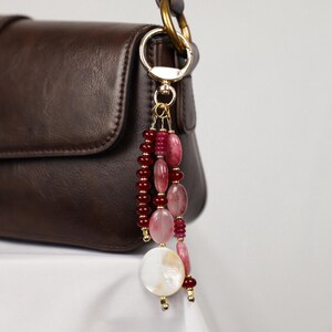 Cherry Wine Charm – Deep Red Beads & Luminous Shell Detail