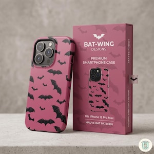 May include: A mauve smartphone case with a black bat pattern and its matching rectangular packaging box. The box features the text BAT-WING DESIGNS, PREMIUM SMARTPHONE CASE, Fits iPhone 15 Pro Max, MAUVE BAT PATTERN, and GOTHIC CHIC COLLECTION.