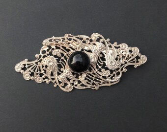 filigree brooch