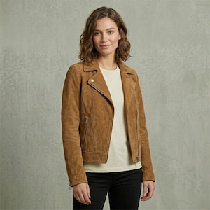 May include: A set of three ceramic nesting bowls in graduating sizes. The bowls feature a speckled, matte finish in shades of cream, light gray, and dark gray. Each bowl has a rounded shape and a slightly flared rim.