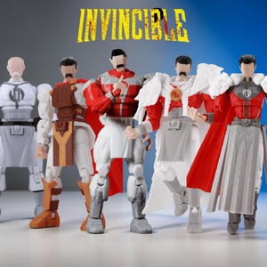 May include: Five Invincible action figures standing in a row. The figures feature various costumes in red, white, gray, and brown, with distinct armor pieces, capes, and emblems. The word INVINCIBLE is printed in yellow at the top of the image.