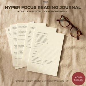 May include: A set of cream-colored reading journal pages with black text titled Hyper Focus Reading Journal, A Gentle Way To Notice How You Read, featuring checklists and writing prompts, accompanied by a pair of brown-rimmed reading glasses.