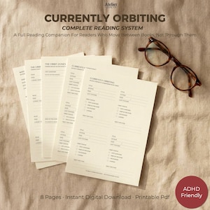 May include: A set of cream-coloured reading tracker sheets titled Currently Orbiting Complete Reading System with fields for book titles, authors, and reading status, accompanied by a pair of brown-rimmed reading glasses on a textured fabric surface.