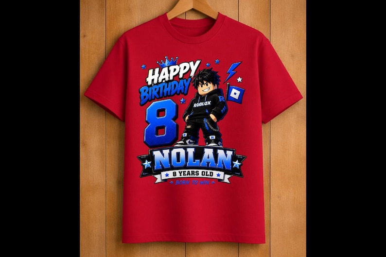 May include: Red t-shirt with a graphic design for an 8th birthday. The design includes the words "Happy Birthday" and "Nolan 8 Years Old" in blue and white, along with a cartoon character and Roblox logo.