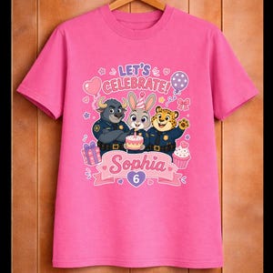May include: Pink t-shirt featuring cartoon characters from Zootopia, with the text "LET'S CELEBRATE!" and the name "Sophia" with the number "6". The design includes balloons, a cupcake, and a birthday cake.