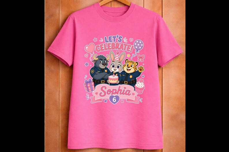 May include: Pink t-shirt featuring cartoon characters from Zootopia, with the text "LET'S CELEBRATE!" and the name "Sophia" with the number "6". The design includes balloons, a cupcake, and a birthday cake.