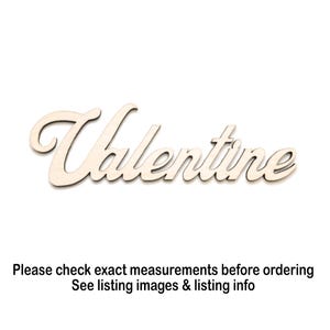 May include: Wooden cutout of the word "Valentine" in a cursive font. The letters are a light beige color, and the cutout is set against a white background. The word is a decorative element.
