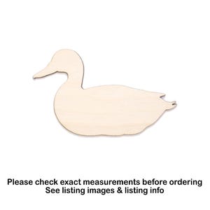 May include: A wooden duck-shaped cutout, ideal for crafting. The duck is depicted in profile, with a curved neck and beak. The wood is a light, natural colour. Text at the bottom says "Please check exact measurements before ordering".