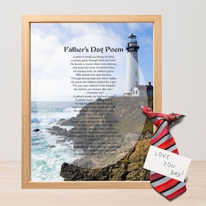 May include: A framed Father's Day poem with a lighthouse image, a red, gray, and black striped tie, and a note that says "Love You Dad!". The poem is in black text on a white background.