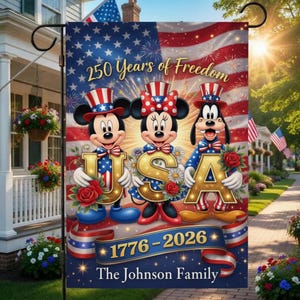 May include: A garden flag with Mickey Mouse, Minnie Mouse, and Goofy holding the letters "USA" against a backdrop of the American flag. The flag reads "250 Years of Freedom" and "1776-2026".