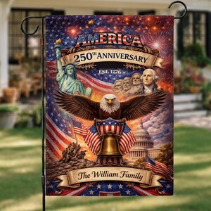 May include: A garden flag with a patriotic design commemorating America's 250th Anniversary. The flag displays the Statue of Liberty, an eagle, the Capitol building, and the American flag. Text includes "America 250th Anniversary" and "Est. 1776".