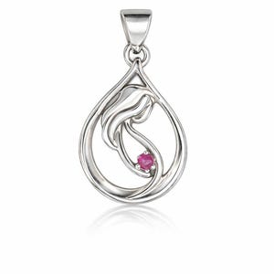 May include: A silver pendant in a teardrop shape, featuring a stylized design of a mother and child. A small, round, red gemstone is set within the design. The pendant has a loop at the top for a chain.