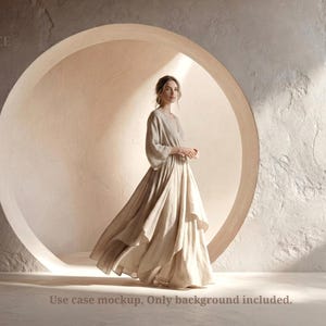 May include: A woman in a beige dress with long sleeves and a flowing skirt stands before a large circular opening. The background is a textured, light-coloured wall. The text "BCE" is in the upper left corner. The text "Use case mockup. Only background included." is at the bottom.