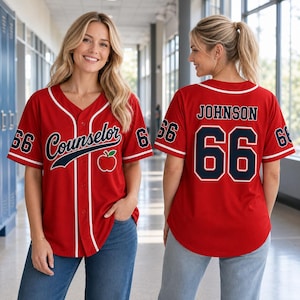 May include: A red baseball jersey with white trim, featuring the word Counselor in navy blue script, a red apple graphic, and the number 66 on the sleeves. The back displays the name Johnson and the number 66 in navy blue with white outlines.