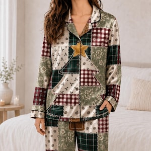 May include: A long-sleeved button-down pajama top and matching pants featuring a patchwork design in shades of dark green, burgundy, and cream. The pattern includes plaid, floral, and polka dot motifs, with a prominent gold star on the chest.
