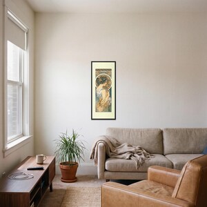 Alphonse Mucha Art Nouveau Print framed art print, 16x40 inch, black wood frame, shown hanging in a living room