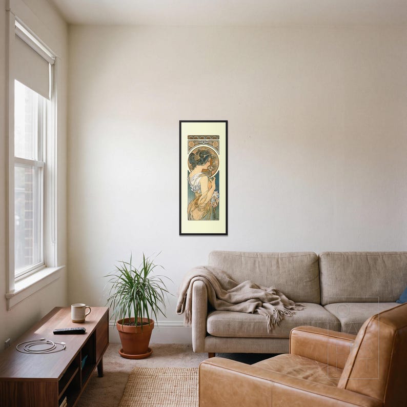Alphonse Mucha Art Nouveau Print framed art print, 16x40 inch, black wood frame, shown hanging in a living room