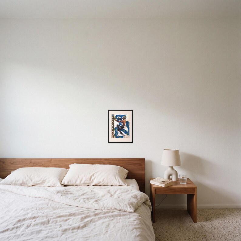 L'après framed art print, 16x22 inch, black wood frame, shown hanging above a bed