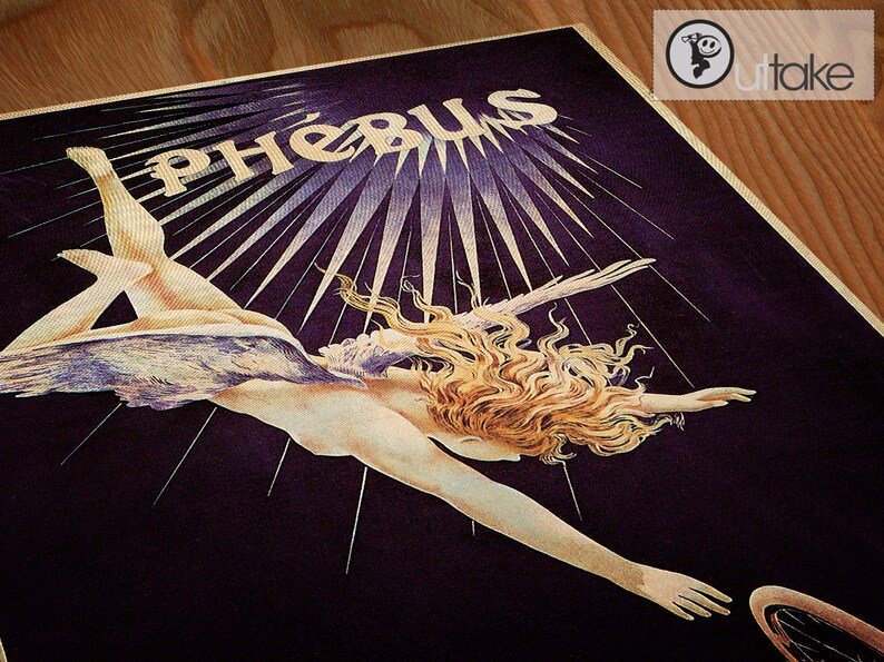 May include: A vintage poster with a woman with long blonde hair flying through the air with wings. The poster has a dark purple background with gold rays of light emanating from the center. The text "Ph&eacute;bus" is written in gold at the top of the poster.