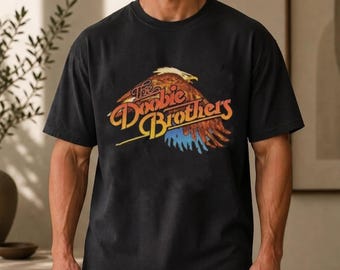 Camiseta vintage de The Doobie Brothers con estampado gráfico y logo de águila. Camiseta retro de la banda.
