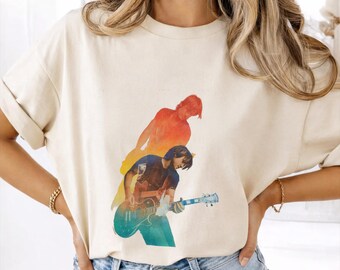 Camiseta de Keith Urban con estampado de acuarela y diseño artístico de música country.