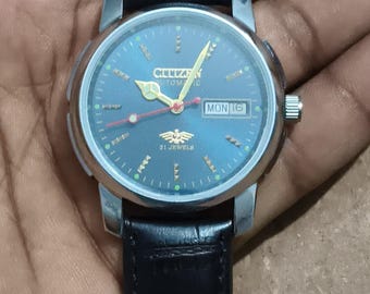 Orologio Citizen vintage automatico con quadrante blu e datario, cinturino in pelle nera.