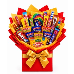 May include: A candy bouquet featuring a variety of colourful sweets including Skittles, Haribo Starmix, Haribo Tangfastics, Jelly Tots, and Mentos. The arrangement is wrapped in red and yellow paper and tied with a large gold satin ribbon bow.