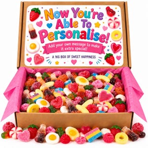 May include: A brown cardboard box filled with a variety of colourful gummy sweets, including strawberry, cola bottle, and fried egg shapes. The inside lid features the text "Now You're Able To Personalise!" and "A 1KG BOX OF SWEET HAPPINESS."