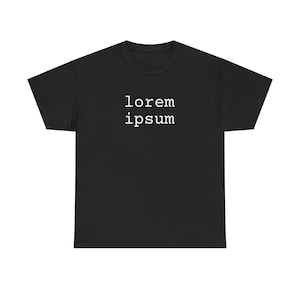 May include: Black t-shirt featuring the white text "lorem ipsum". The text is centrally positioned. The t-shirt has a crew neck and short sleeves. The material looks like a soft cotton blend.