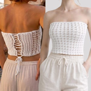 May include: White crochet tube top with a lace-up back detail. The top has a textured, open-weave design. The image shows the front and back of the top. The top is paired with light-colored pants.
