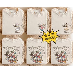 May include: Six off-white t-shirts featuring Disney character graphics. The top row shows individual characters inside Mickey-shaped outlines with the text Name. The bottom row displays a group of characters with the text Walt Disney World Since 1971. A yellow starburst graphic reads WE DO ALL CHARACTER.
