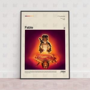 Op de afbeelding: Ingelijste poster met het woord "Fable" in witte letters. De afbeelding toont een jong personage met een zwaard, weerspiegeld in een vurig, cirkelvormig ontwerp. De poster bevat het jaar 2004 en de datum 21 september.