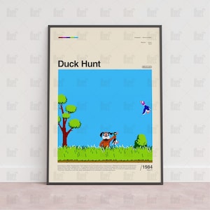May include: Framed poster featuring the classic video game "Duck Hunt." The artwork depicts a dog, a duck, and a grassy field against a blue sky. The title "Duck Hunt" is prominently displayed, along with the year 1984.