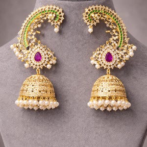 Gold-Plated Peacock Motif Jhumka Earrings with Ruby & Emerald Accents | Traditional Indian Bridal Ear-Cuffs with Pearl Droplets.