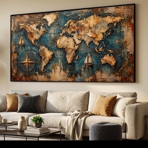 May include: A rectangular wall art piece featuring a textured world map in shades of gold, bronze, and deep blue. The map includes illustrations of two sailboats and a compass rose on the left side, all enclosed within a thin black frame.